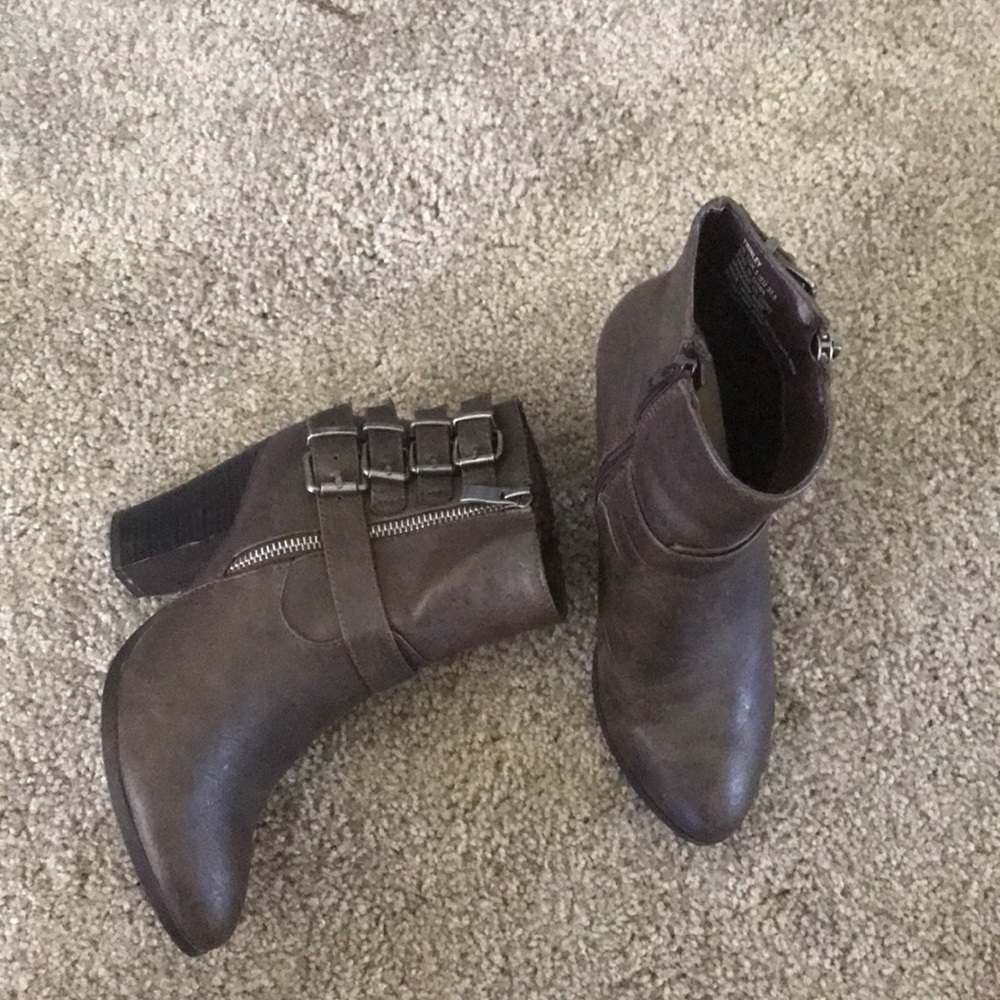Charcoal gray bootie with silver buckles on side.